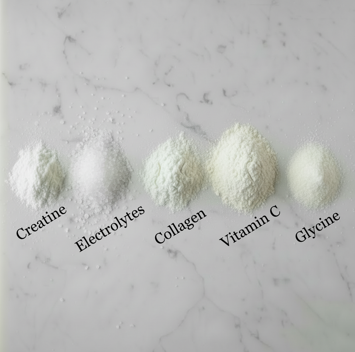 Five types of powders labeled Creatine, Electrolytes, Collagen, Vitamin C, and Glycine on a marble surface.